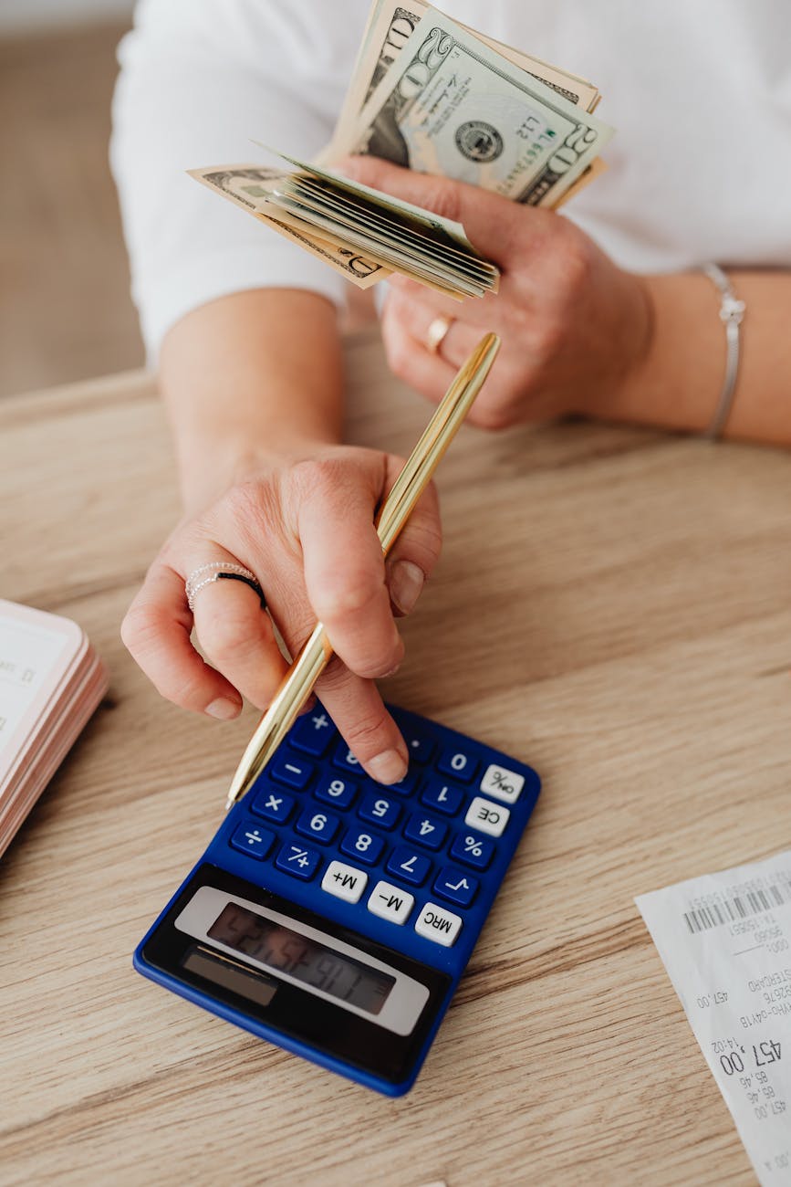 close up of a person using a calculator